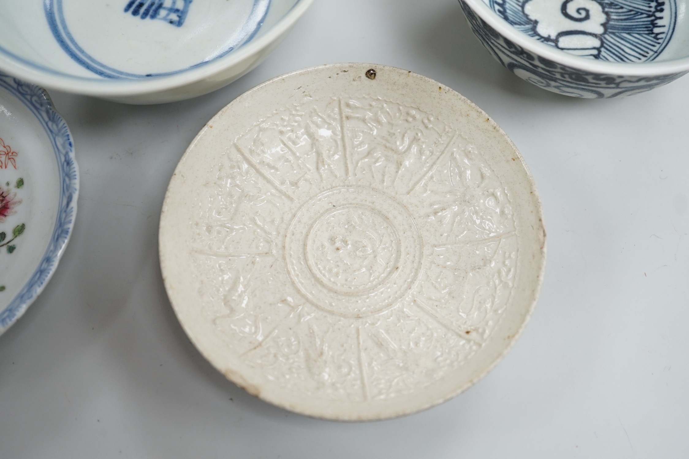 A small Chinese Ming blue and white bowl, and other, together with two small saucers (4)